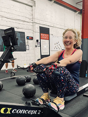 Smiling woman on a rowing machine