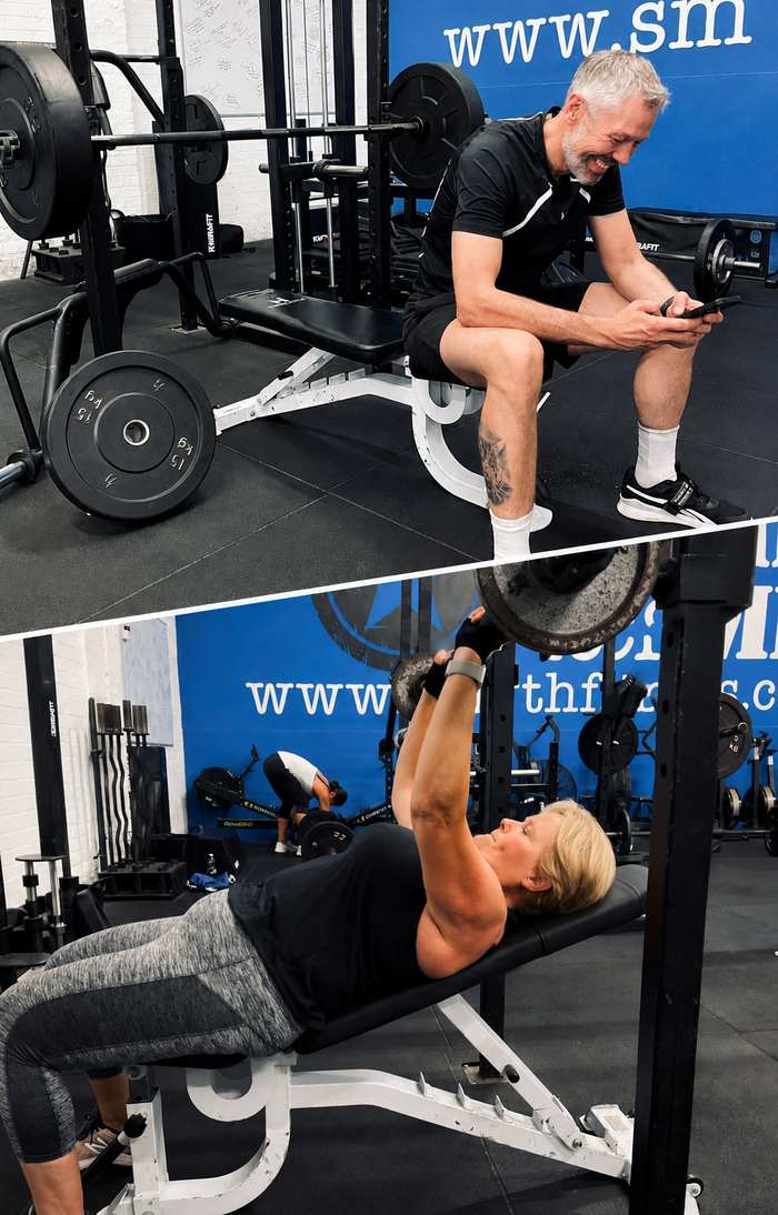 Member performing a bench press in the Smyth Fitness gym