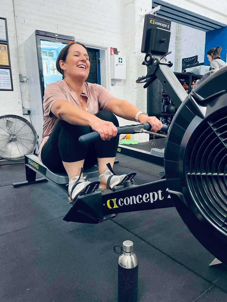 Woman working out on a rowing machine